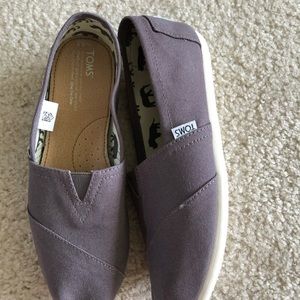 Brand new Toms slip on sneakers